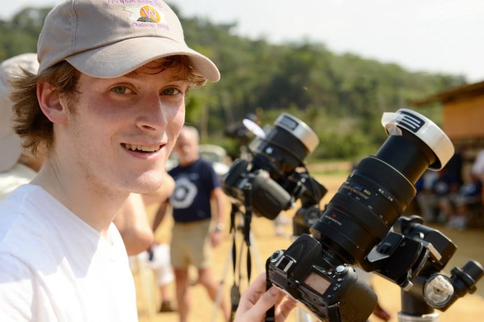 Allen smiling with camera equipment before the 2013 eclipse in Gabon
