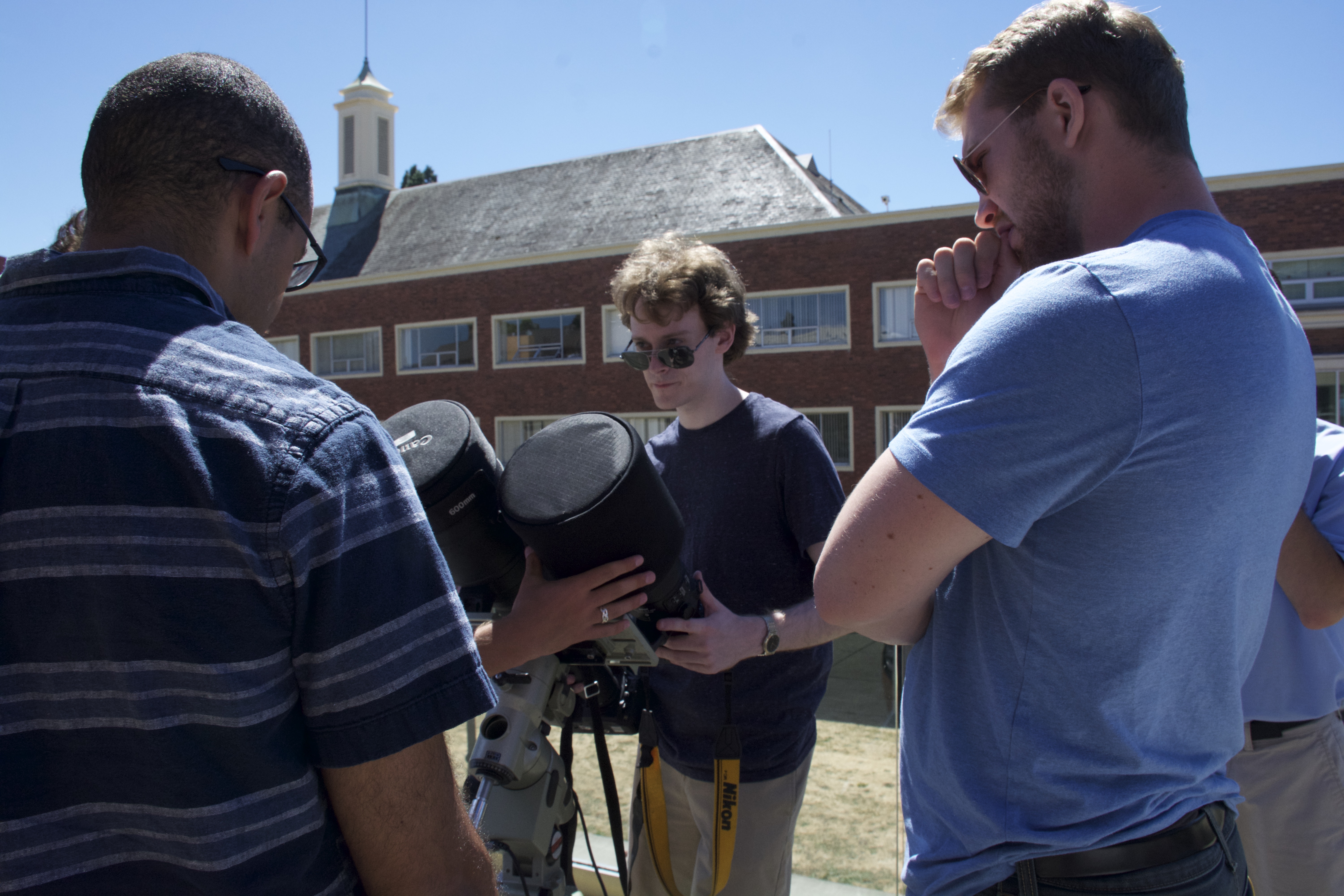 Allen and colleagues examining camera equipment before the 2017 eclipse